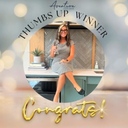 woman posing with award