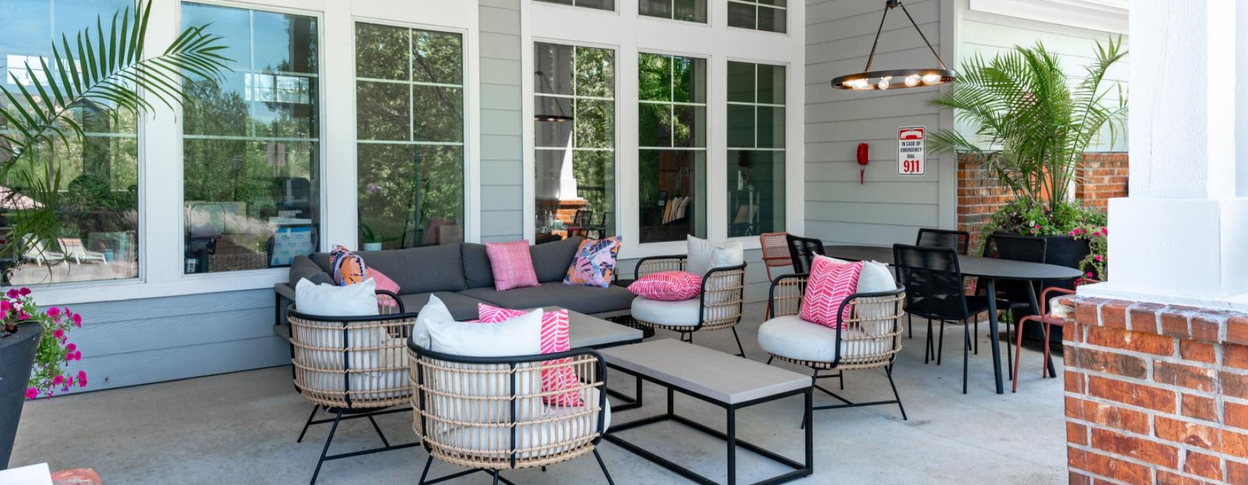 an outdoor patio with a couch and sitting area