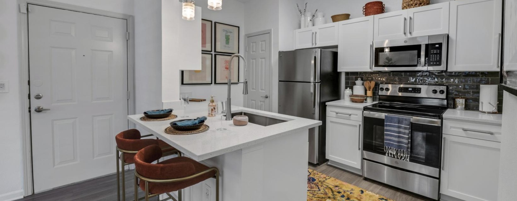 a kitchen with white cabinets