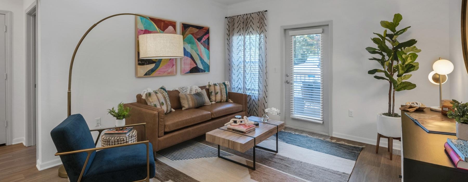 a living room with a couch and a fan